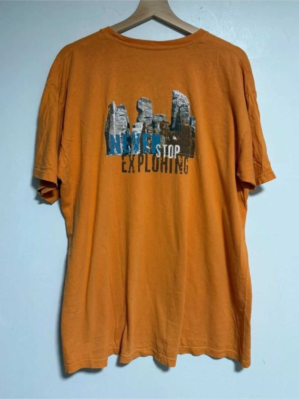 The North Face “Never Stop Exploring” Graphic Tee Orange Men’s Large